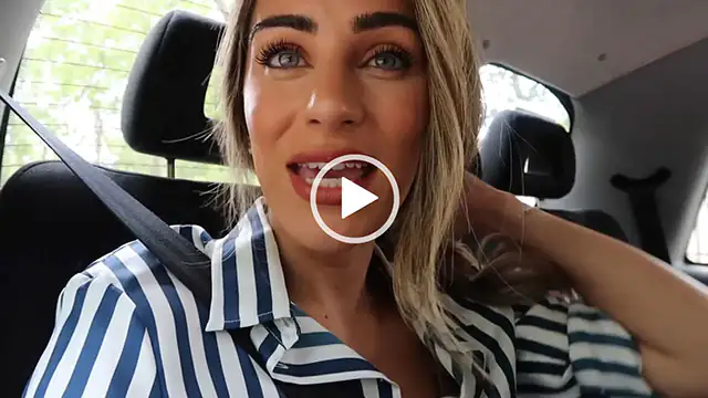 Lydia Millen is seen in a white and blue stripe shirt as she travels in the back of a London taxi. Lydia wears her hair back with a dark lipstick and curled eye lashes.