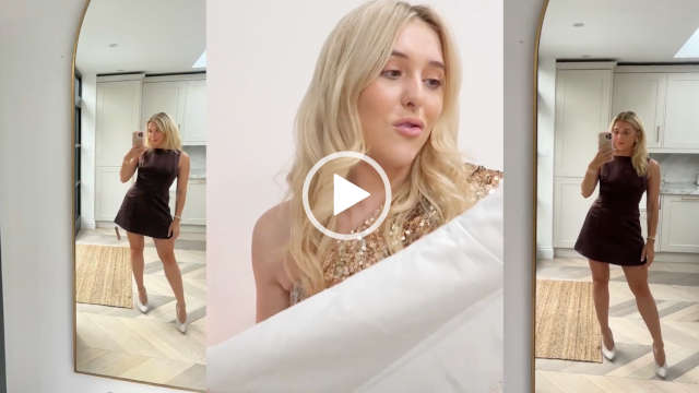 A split screen view of Em Sheldon during a fashion haul. Em holds up and looks at a white dress. She sits in front of a dark white wall. There is an overlay of two photos of her standing in front of her kitchen mirror wearing a brown version of the dress. Em is seen with her long blonde hair in loose waves. She appears in a gold sparkle one shoulder top.